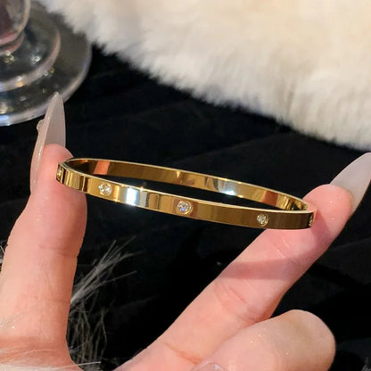 AuraBracelet™ – Titanium Gold Bracelet with Zircon